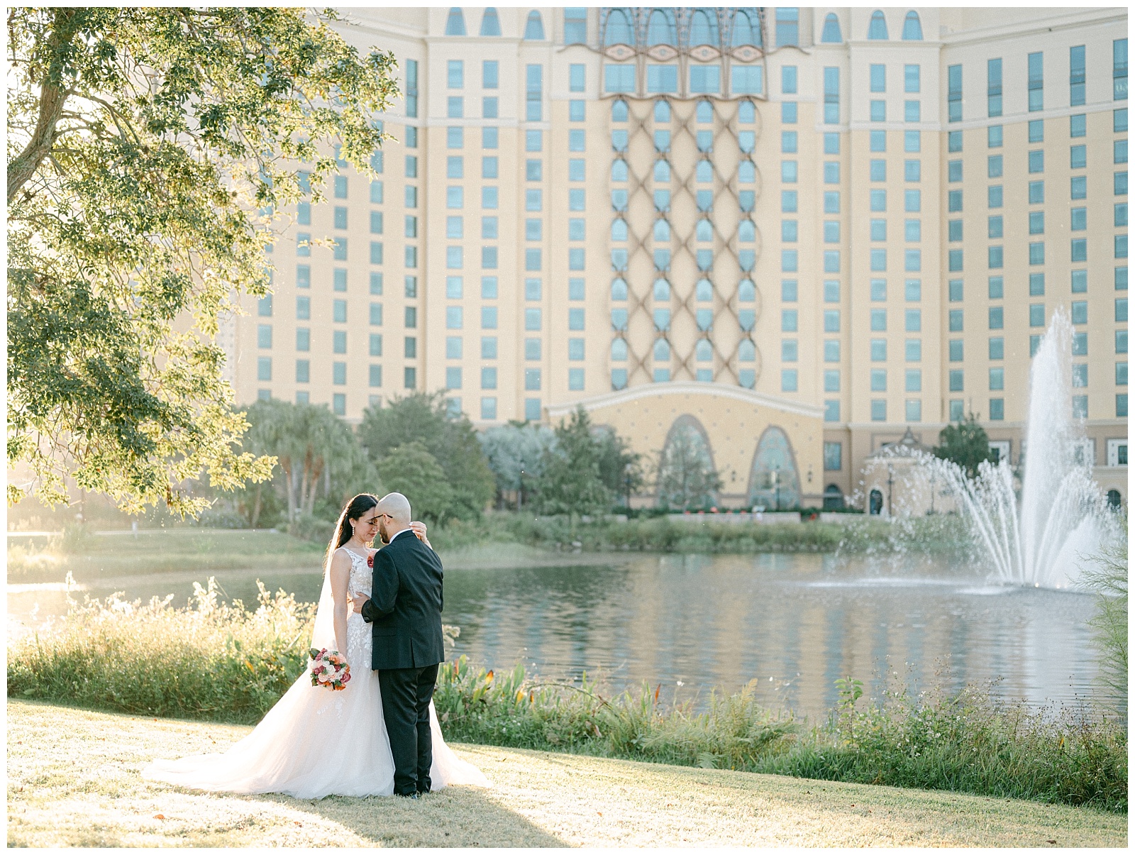 Bride and Groom embrace by Disney's Riviera Resorts Lake by Elizabeth Kane Photography in Orlando Florida