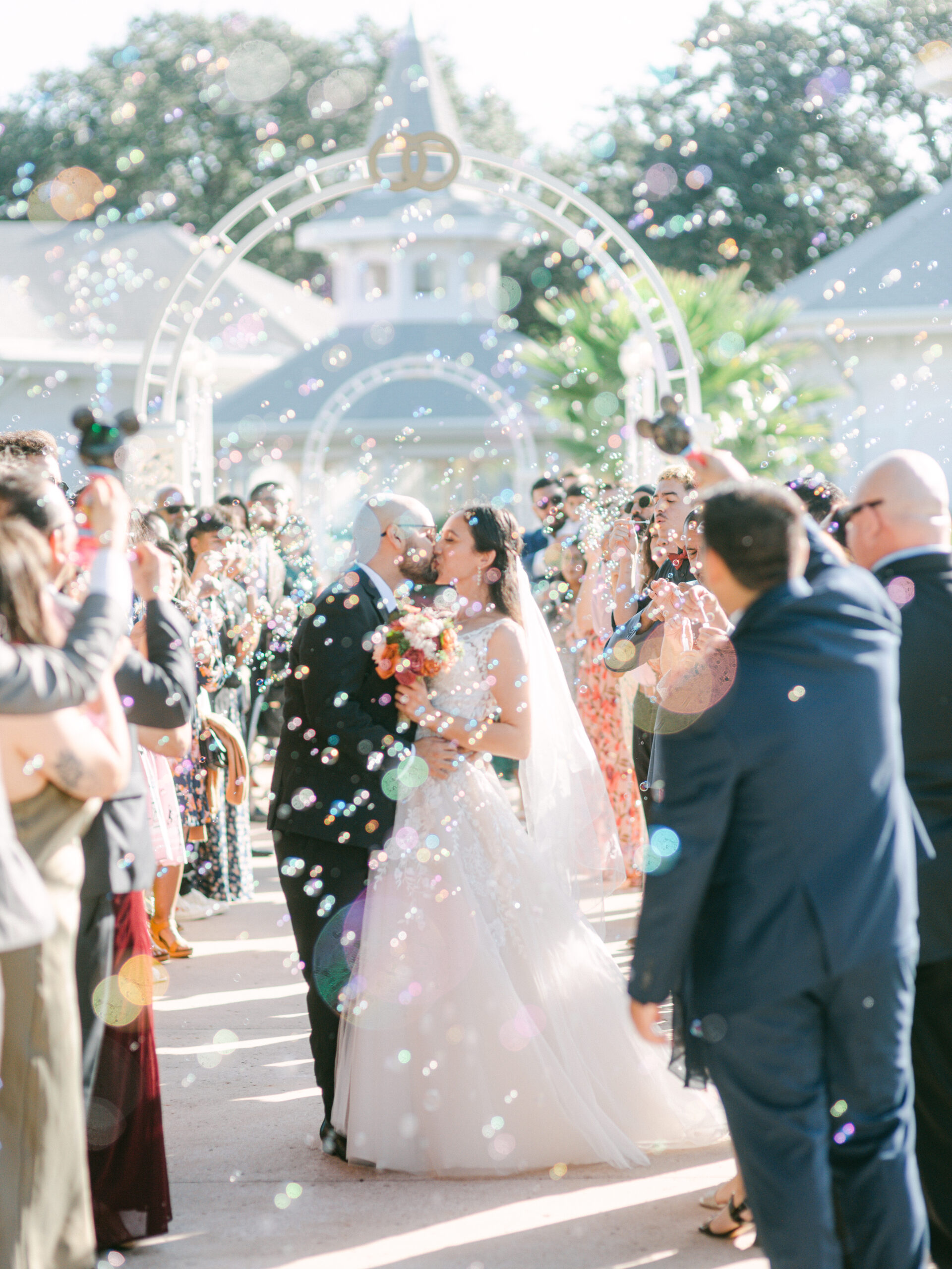 Disney Wedding bubble exit photo leaving disney's wedding pavilion by Elizabeth Kane Photography California Colorado Orlando Florida Documentary Wedding Photographer