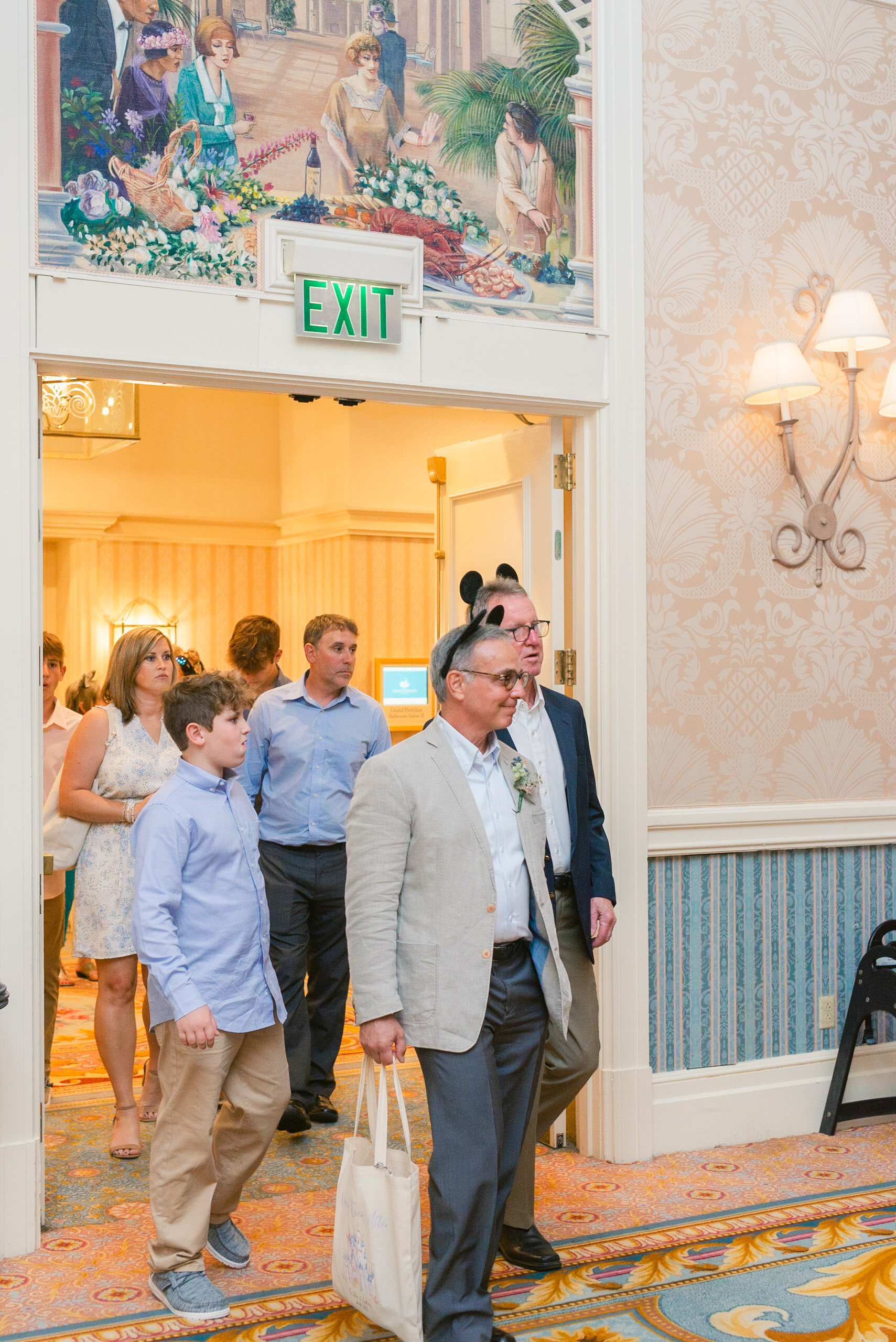 Guests entering reception at Grand Floridian Ballroom in Orlando Florida by Elizabeth Kane Photography Documentary and Editorial Light and Airy California Colorado Florida Wedding Photographer 