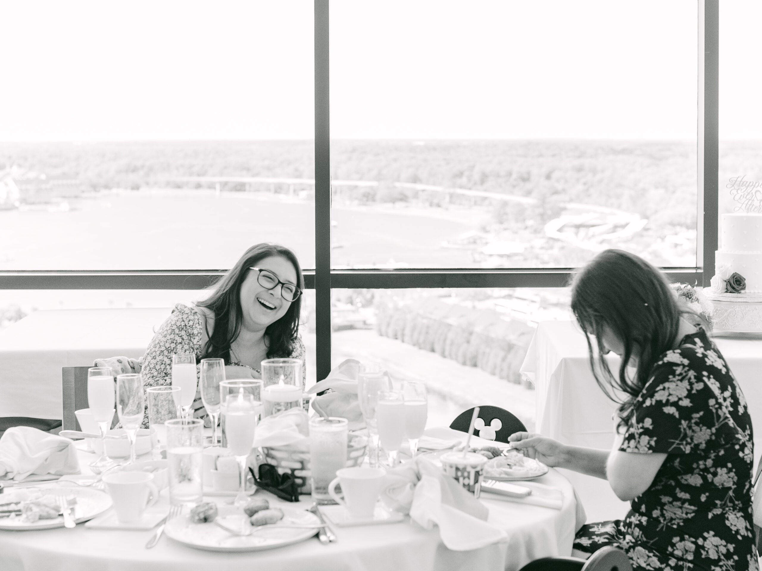 Friends sharing a candid celebration moment at the wedding reception by Elizabeth Kane Photography Orlando Florida Disney Destination Wedding Photographer