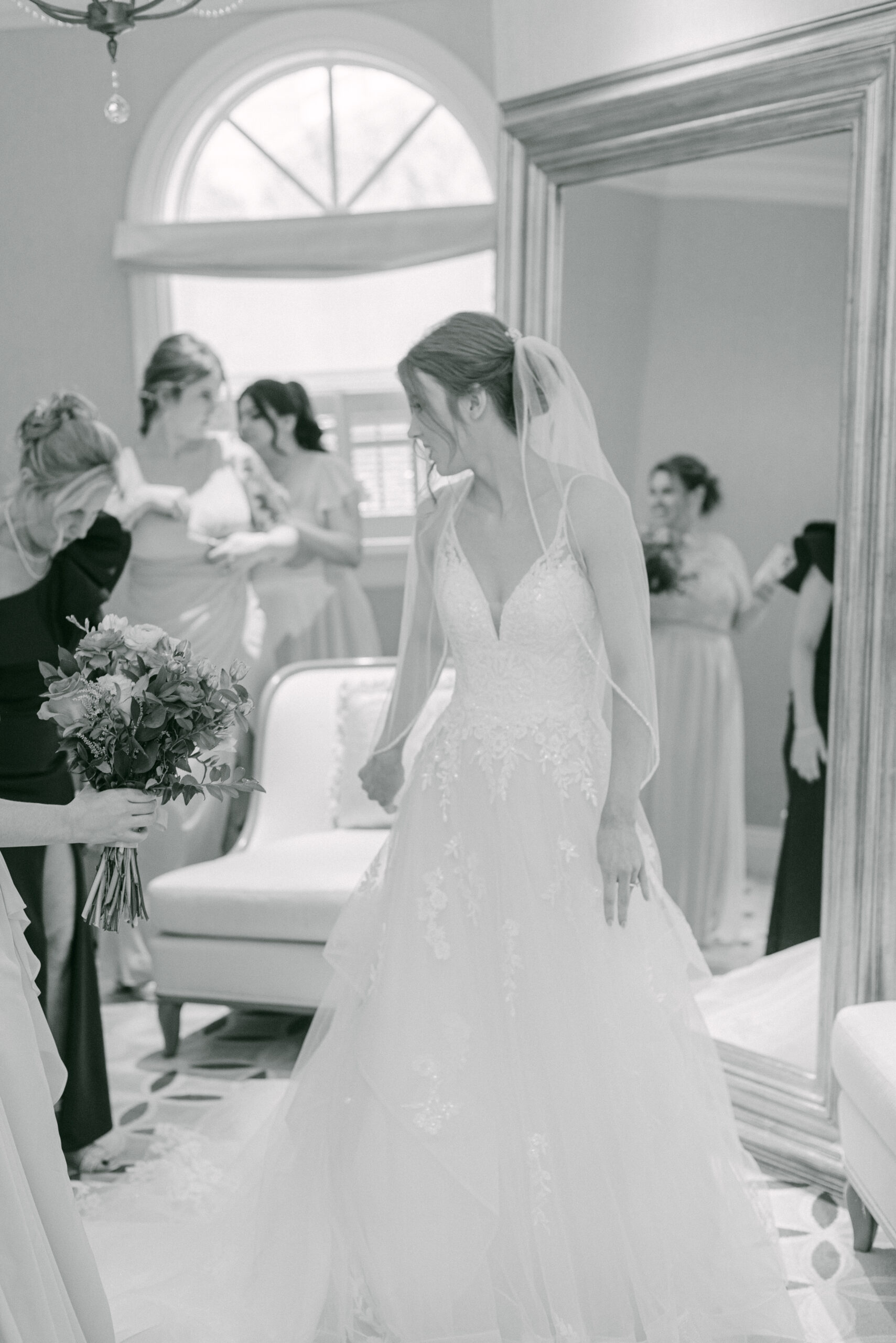 Candid shot of the bride laughing with her bridesmaids while getting ready in the morning by Elizabeth Kane Photography Disney Destination Wedding Photographer Orlando Florida