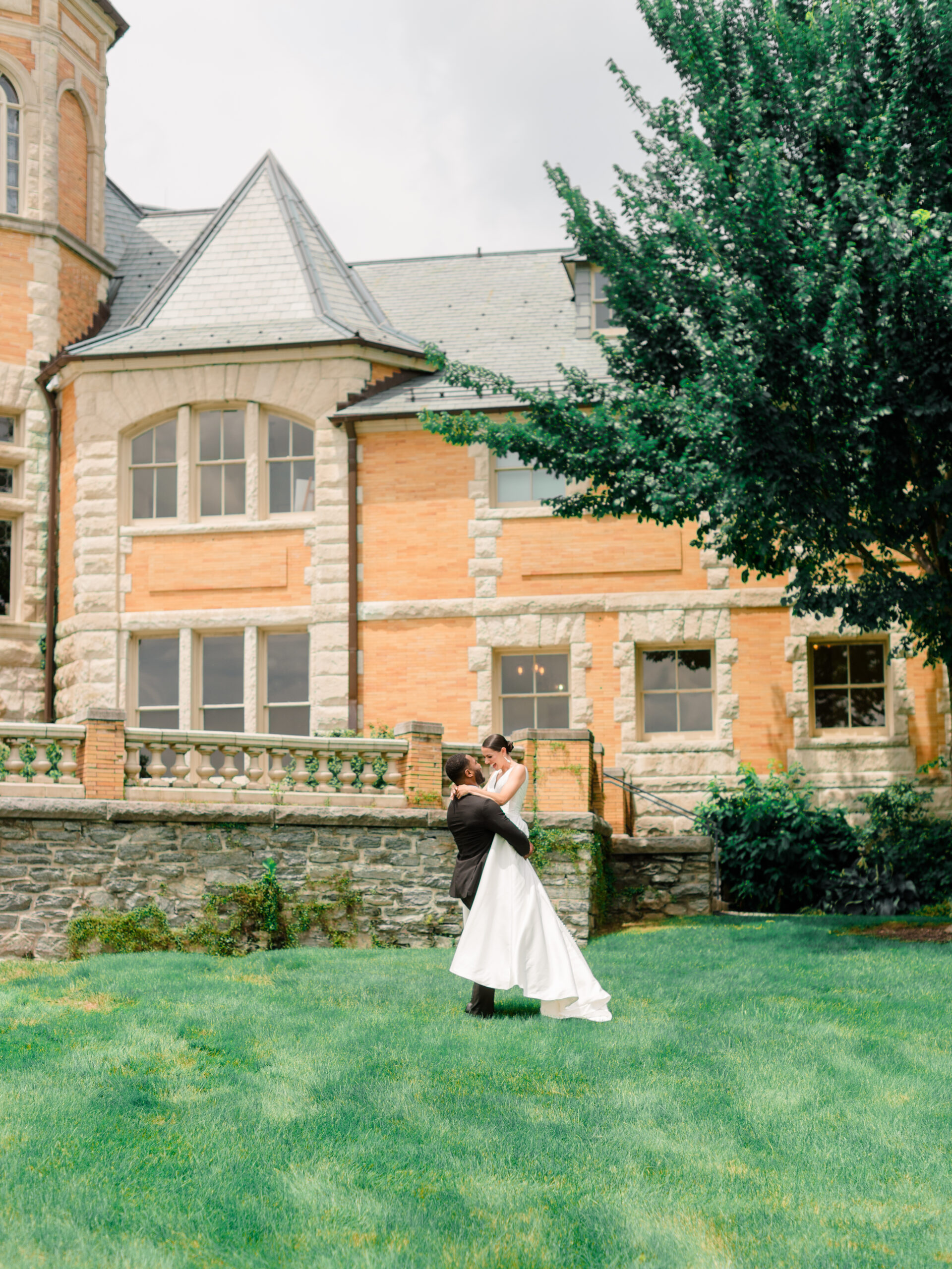 Wedding portrait at Cairnwood Estate wedding venue in Bryn Athyn, Pennsylvania, featuring a couple standing together on the estate grounds.