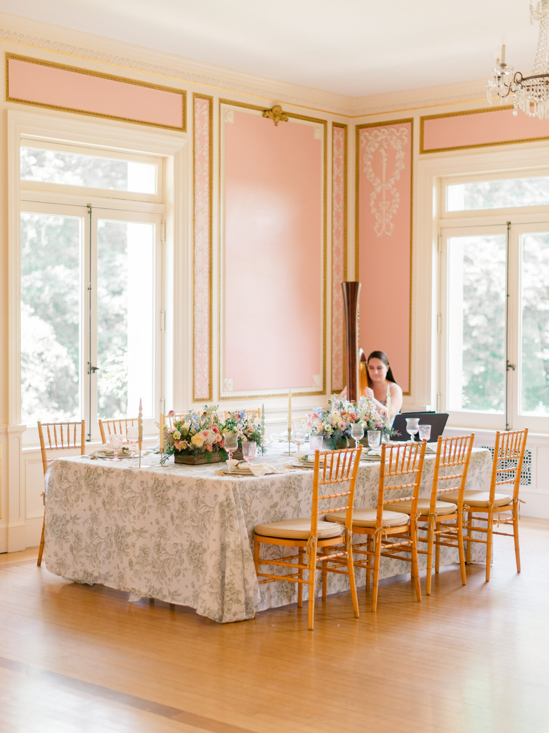 Wedding reception table design inside Cairnwood Estate wedding venue in Bryn Athyn, Pennsylvania, styled with florals, candles, and classic seating.