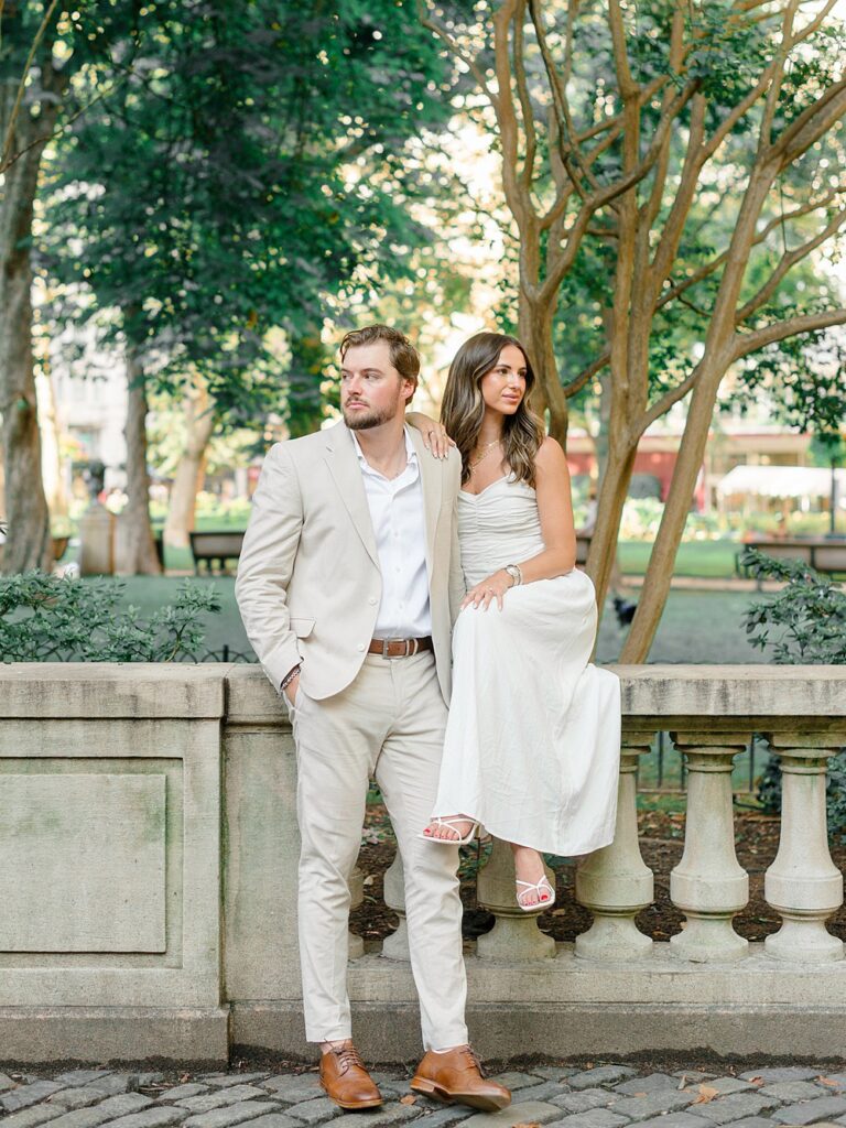 couple walking through the city modeling Philadelphia Engagement Photo Outfits