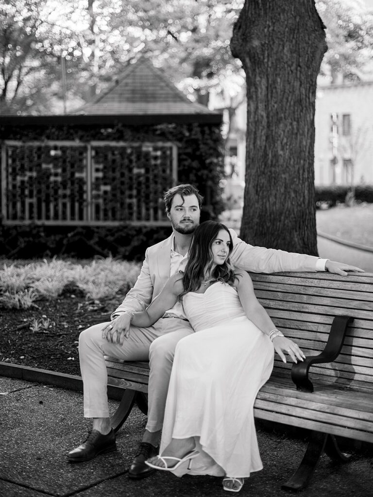 couple posing on a bench for Rittenhouse Square engagement photos