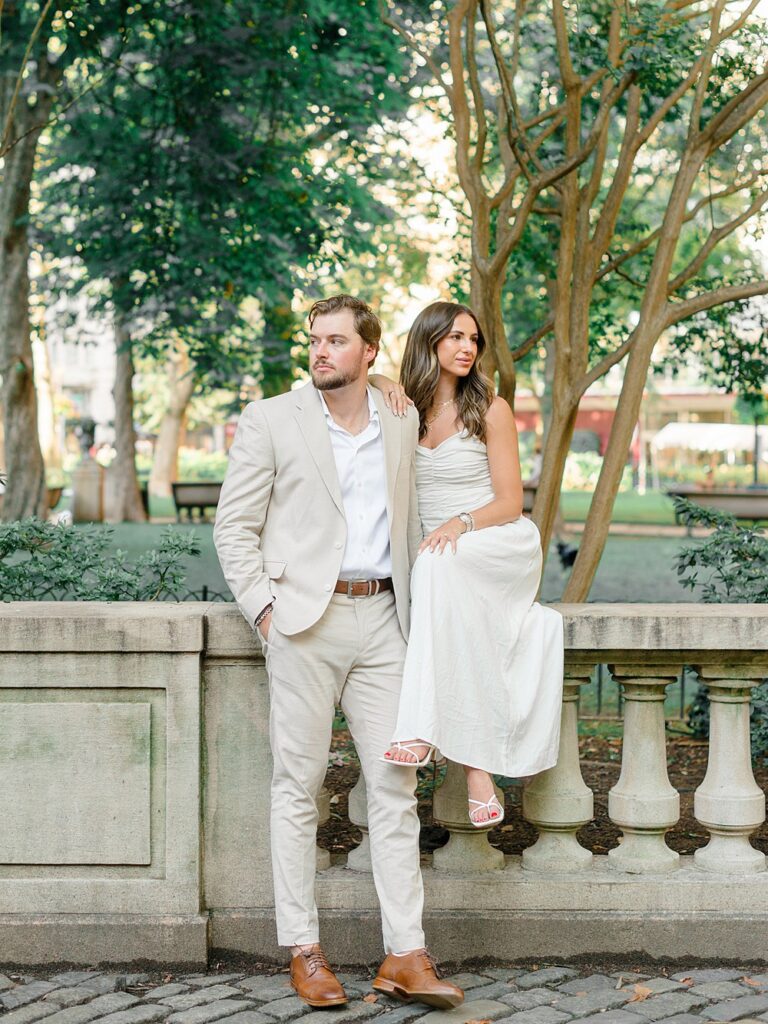 couple posing on the street for Rittenhouse Square engagement photos